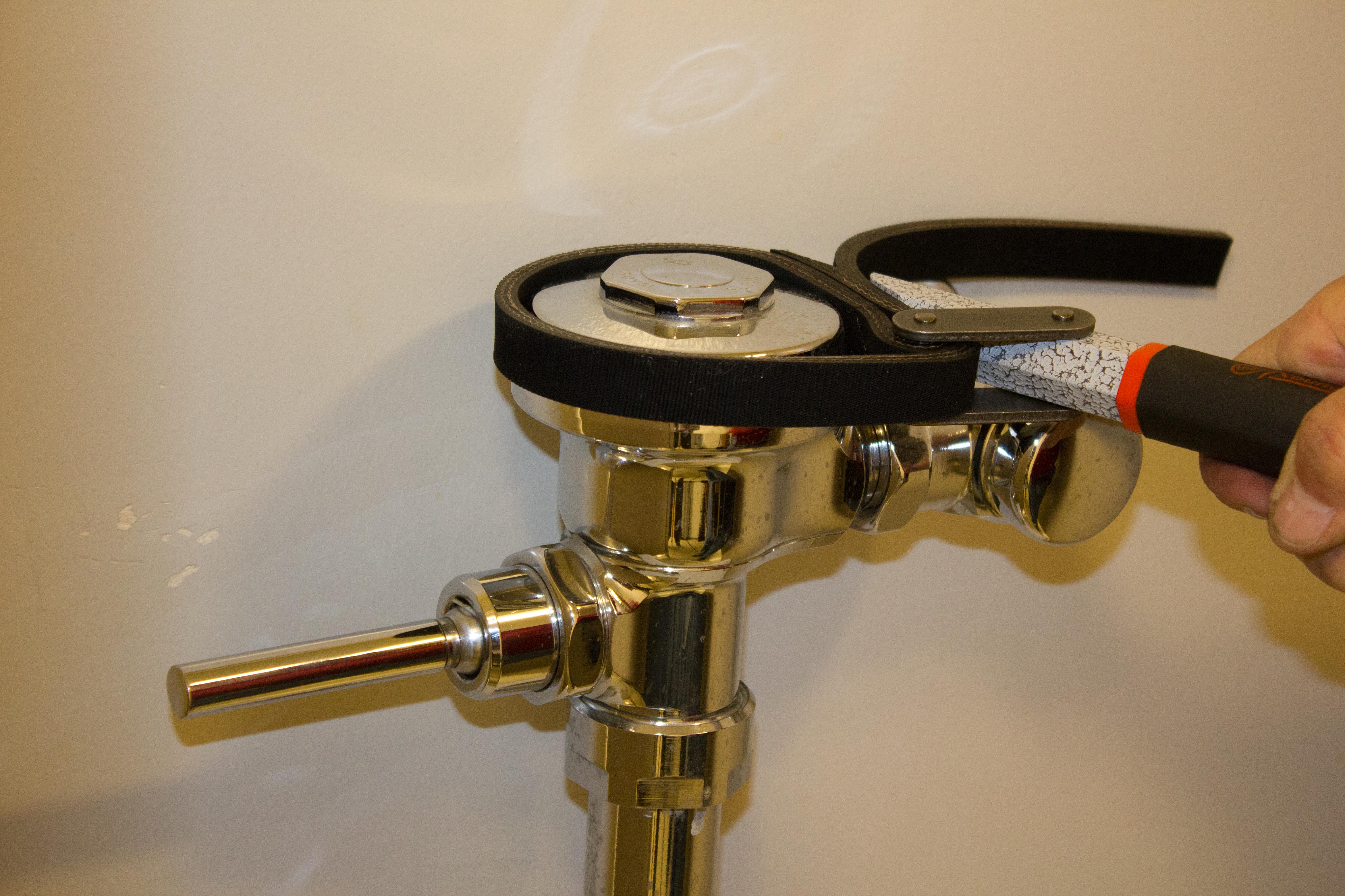 Round Wrench on polished chrome plumbing